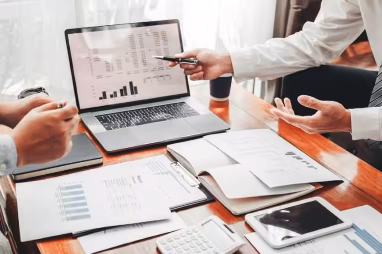 Knowledgeable man leads office team to financial success with expert accounting services.