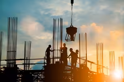 Construction site workers building with confidence through comprehensive insurance products.
