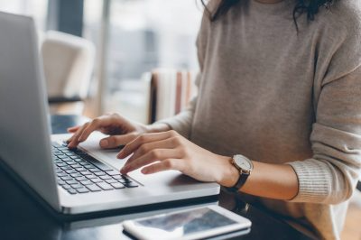 Woman searching for insurance products online.