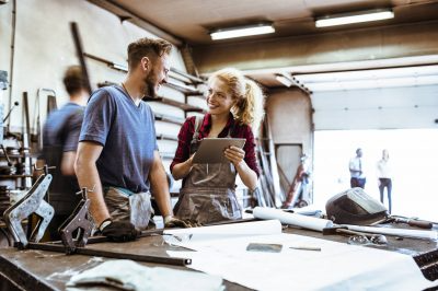 Man and woman discussing investment opportunities and insurance products for security.