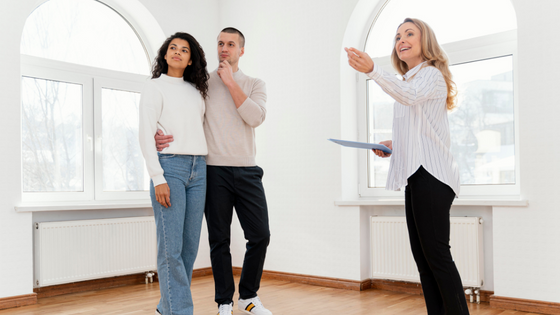 Young couple investors seeking guidance from a real estate agent