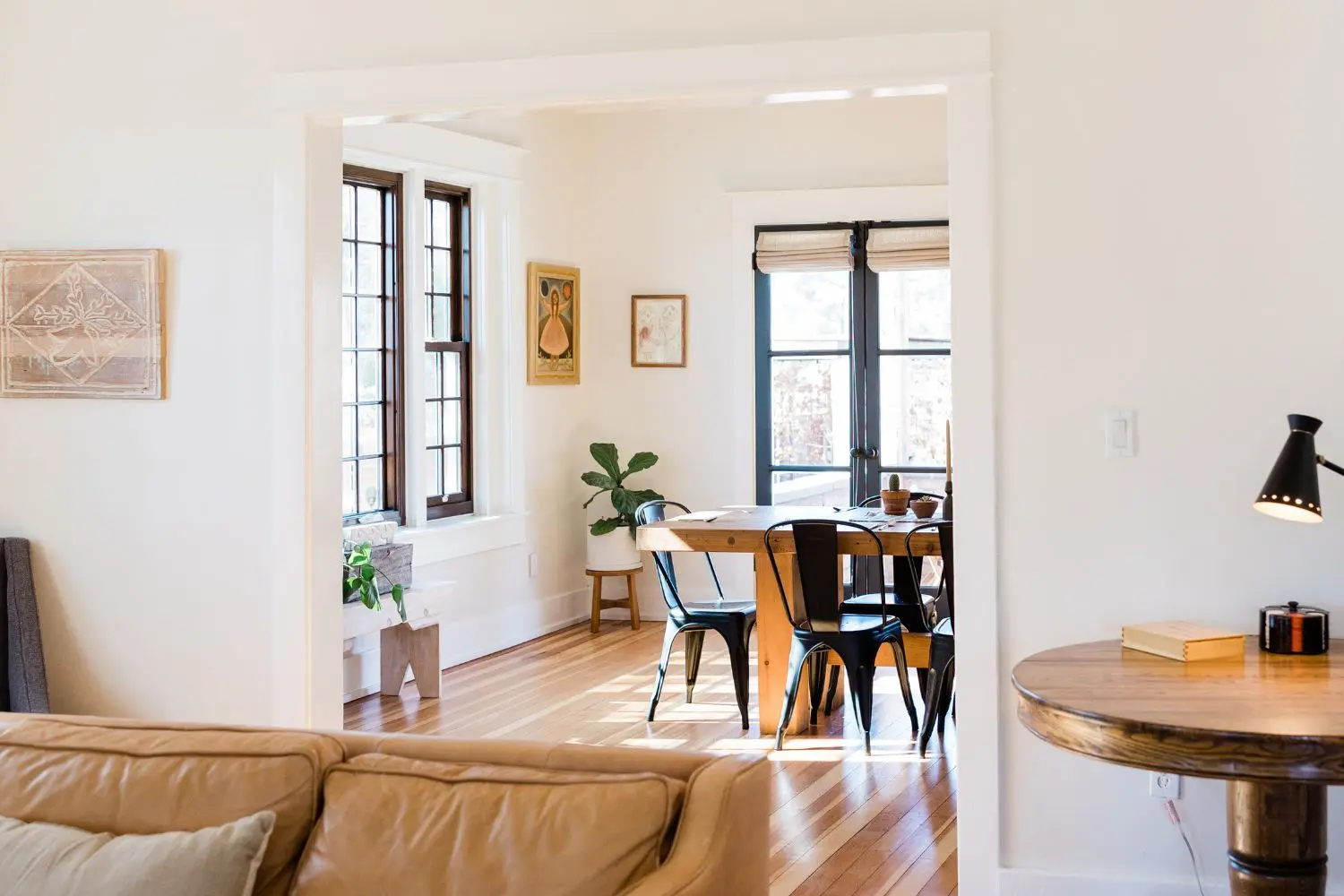 Bright dining room with wooden table and chairs thanks to Penrith Mortgage Broker