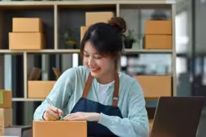 Small business owner organising stock with support from Tanti Financial accounting and business advisory services.