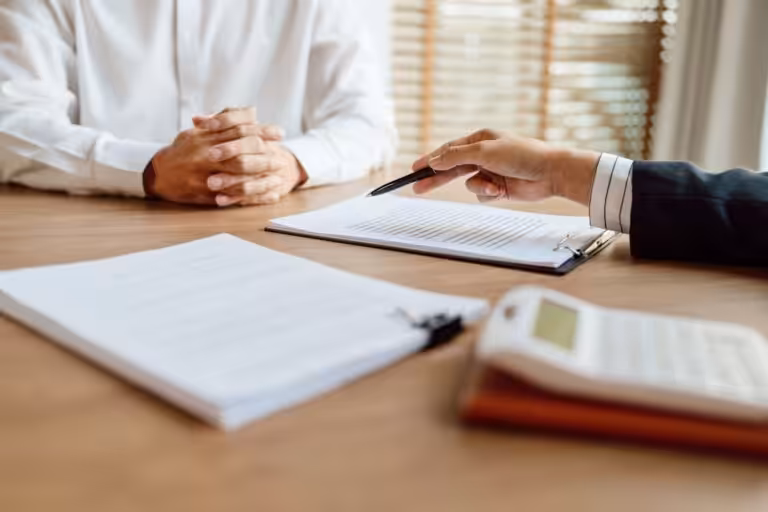 Business meeting reviewing finances with professional accounting, tax planning and financial advisory services.