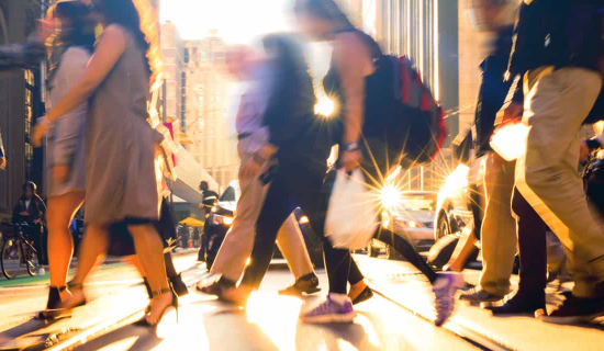 People walking on a busy street, highlighting the importance of public liability in everyday life.